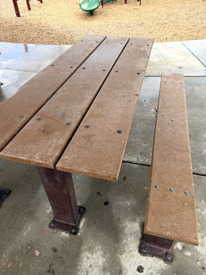 Same picnic bench cleaned and restored after pressure washing