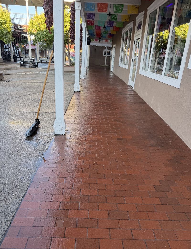 Freshly pressure washed brick paver walkway outside Old Town Albuquerque storefronts